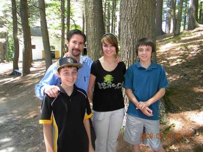 Todd Sawyer with his sons Jordan and Brad and daughter Brianna pause under the pines