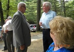 Bud Shrugue (right) welcomes a guest