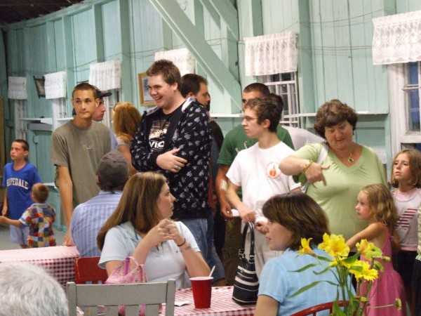 Friends in line and at the tables. Fellowship abounds