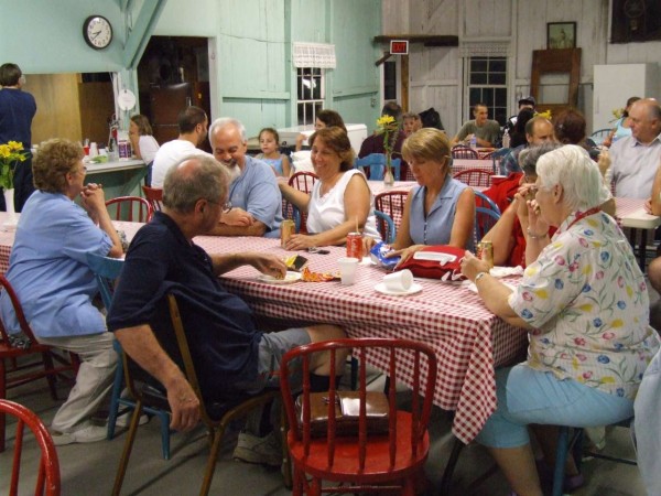 Round table discussions at rectangular tables